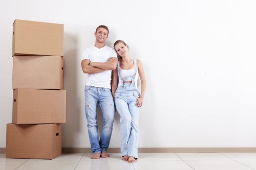 Movers preparing a safe residential relocation with protective equipment