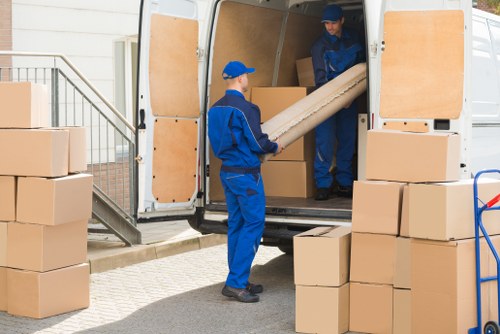 Furniture removal team loading household items in Sutton