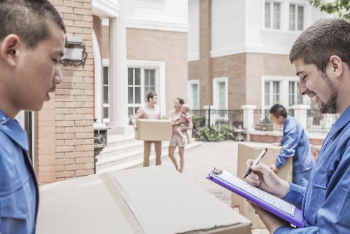 Professional Sutton movers beginning a residential relocation with careful packing