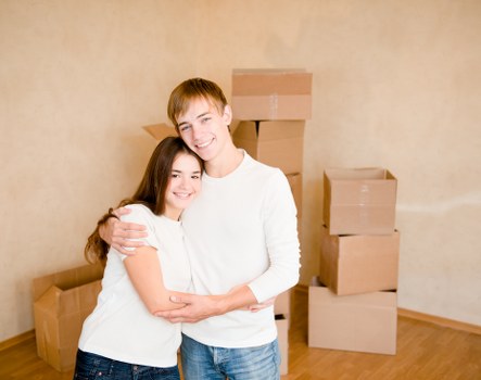 Packed boxes and furniture ready for removals in a Sutton home
